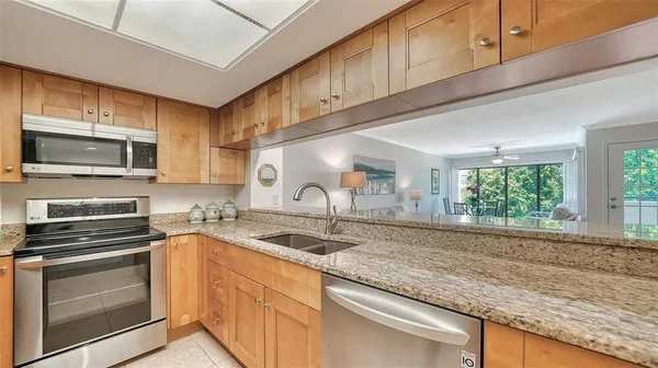 a bed room with a bed and a chandelier