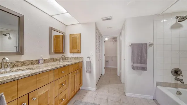 a view of a backyard with plants and a garden