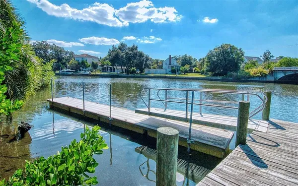 a front view of multi story building with retail shops