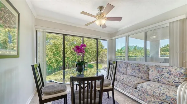 a view of a chair and table in the room