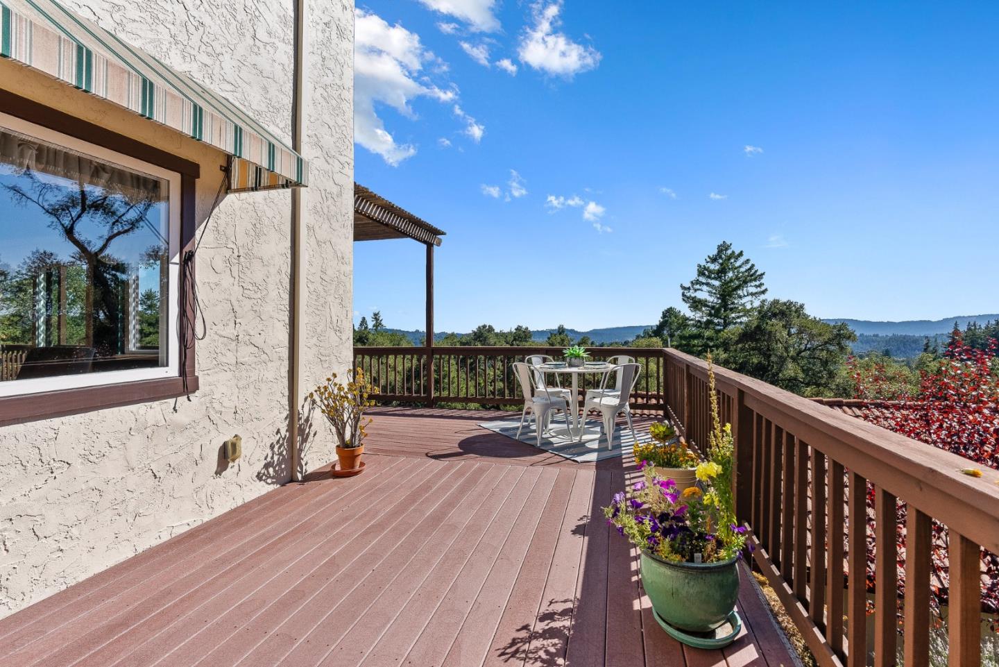 1375 Weston Ridge Road Scotts Valley, CA 95066 - Photo 15 of 68 a balcony with outdoor seating and wooden floor