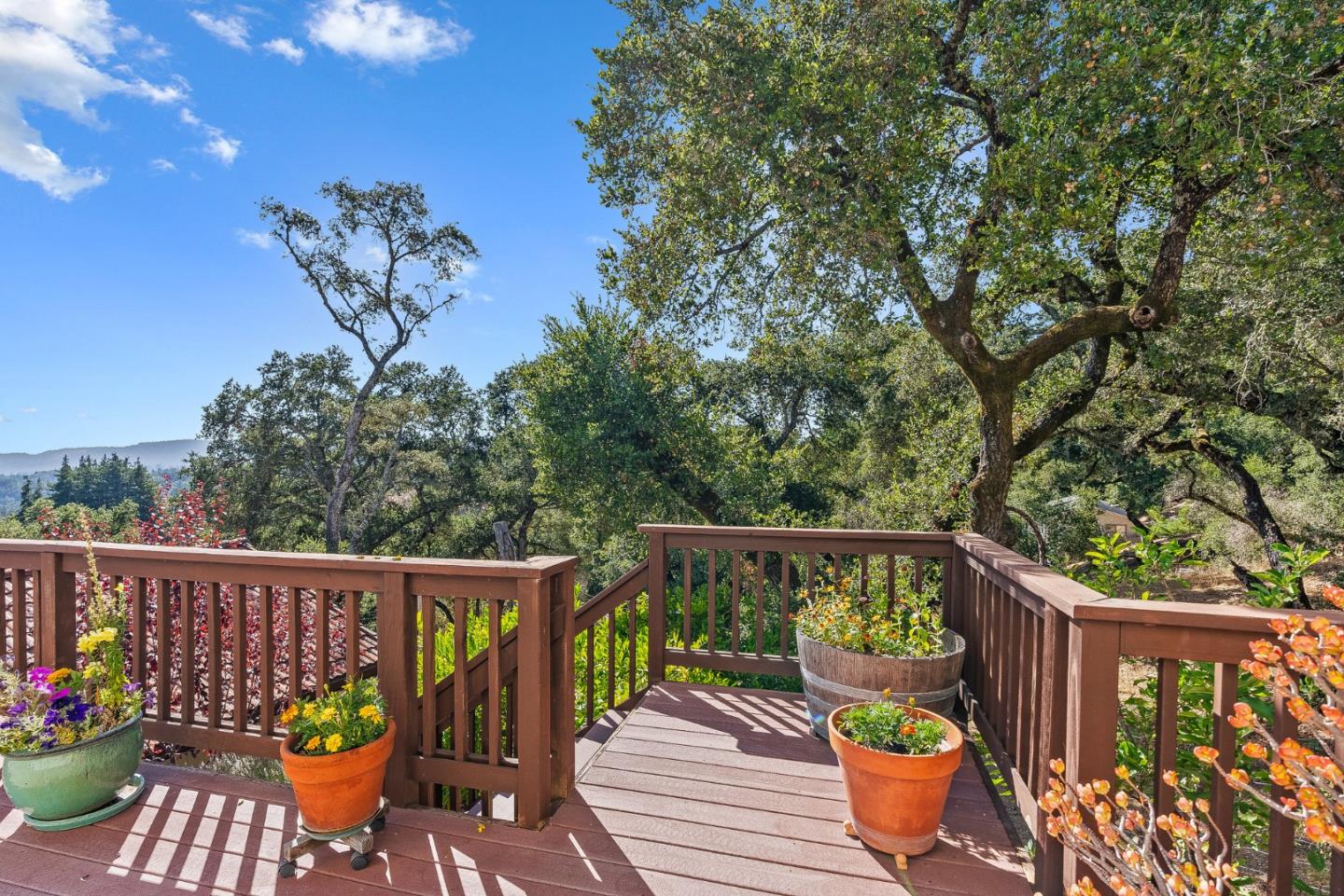 1375 Weston Ridge Road Scotts Valley, CA 95066 - Photo 16 of 68 a view of a deck with chairs and wooden floor