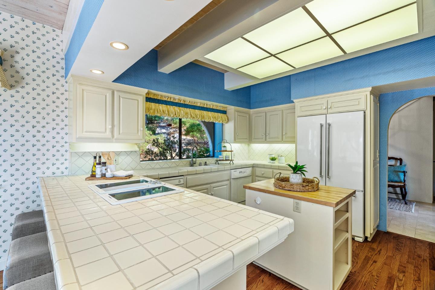 1375 Weston Ridge Road Scotts Valley, CA 95066 - Photo 32 of 68 a kitchen with stainless steel appliances kitchen island granite countertop a sink cabinets and wooden floor