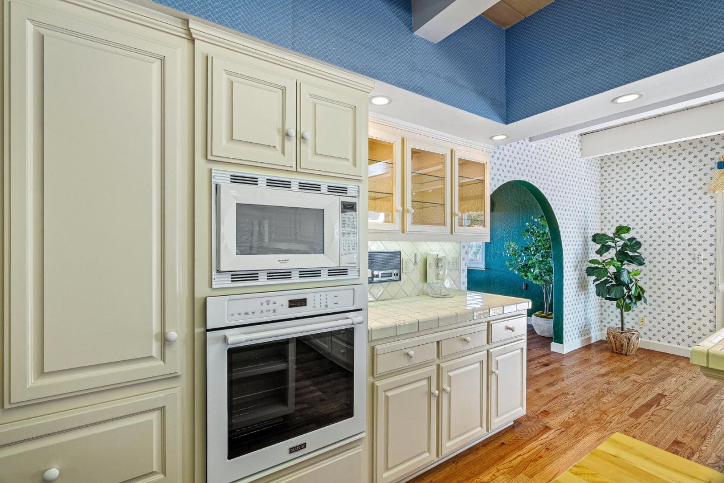 1375 Weston Ridge Road Scotts Valley, CA 95066 - Photo 33 of 68 a kitchen with stainless steel appliances white cabinets and a stove