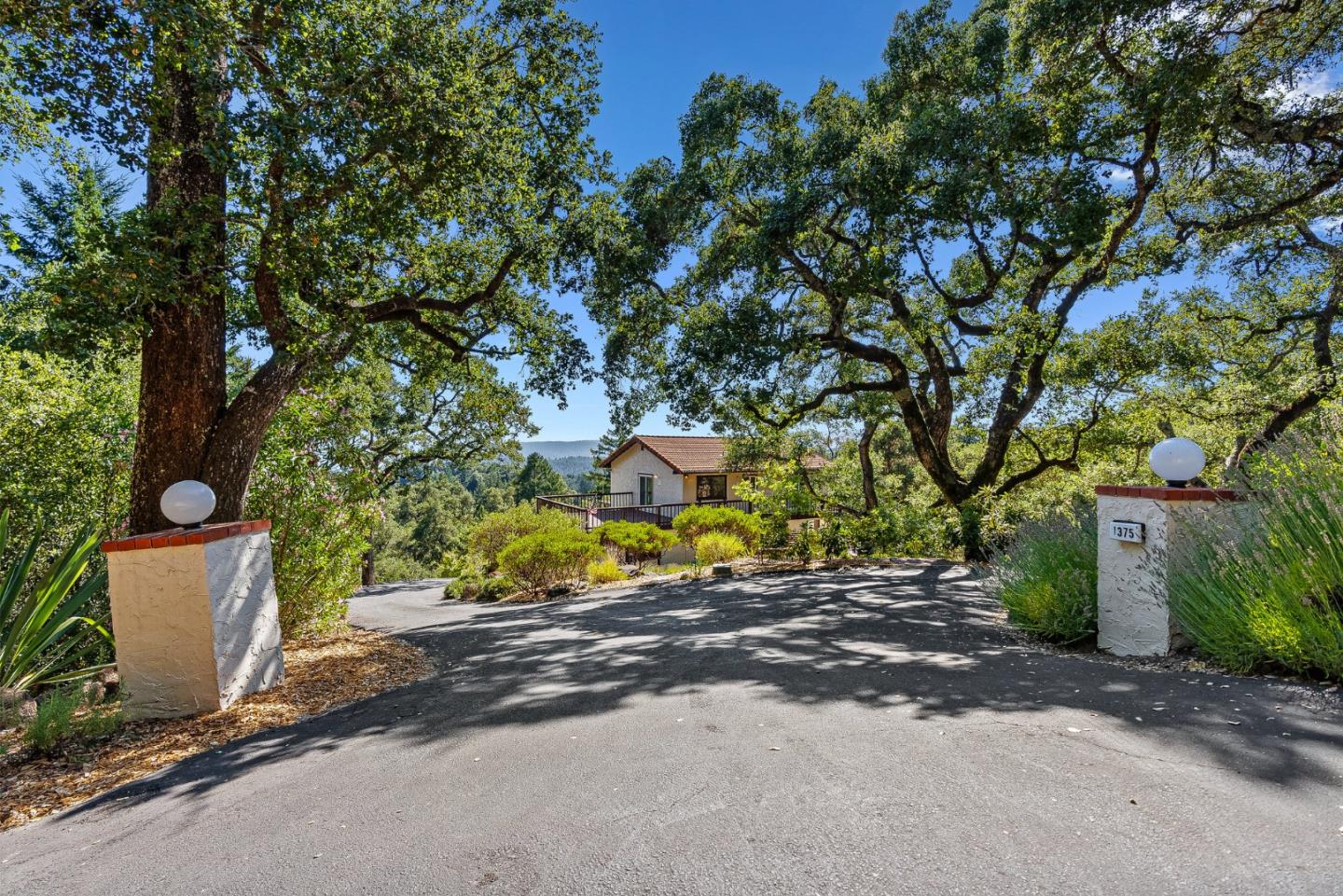 1375 Weston Ridge Road Scotts Valley, CA 95066 - Photo 4 of 68 a view of a street with a tree
