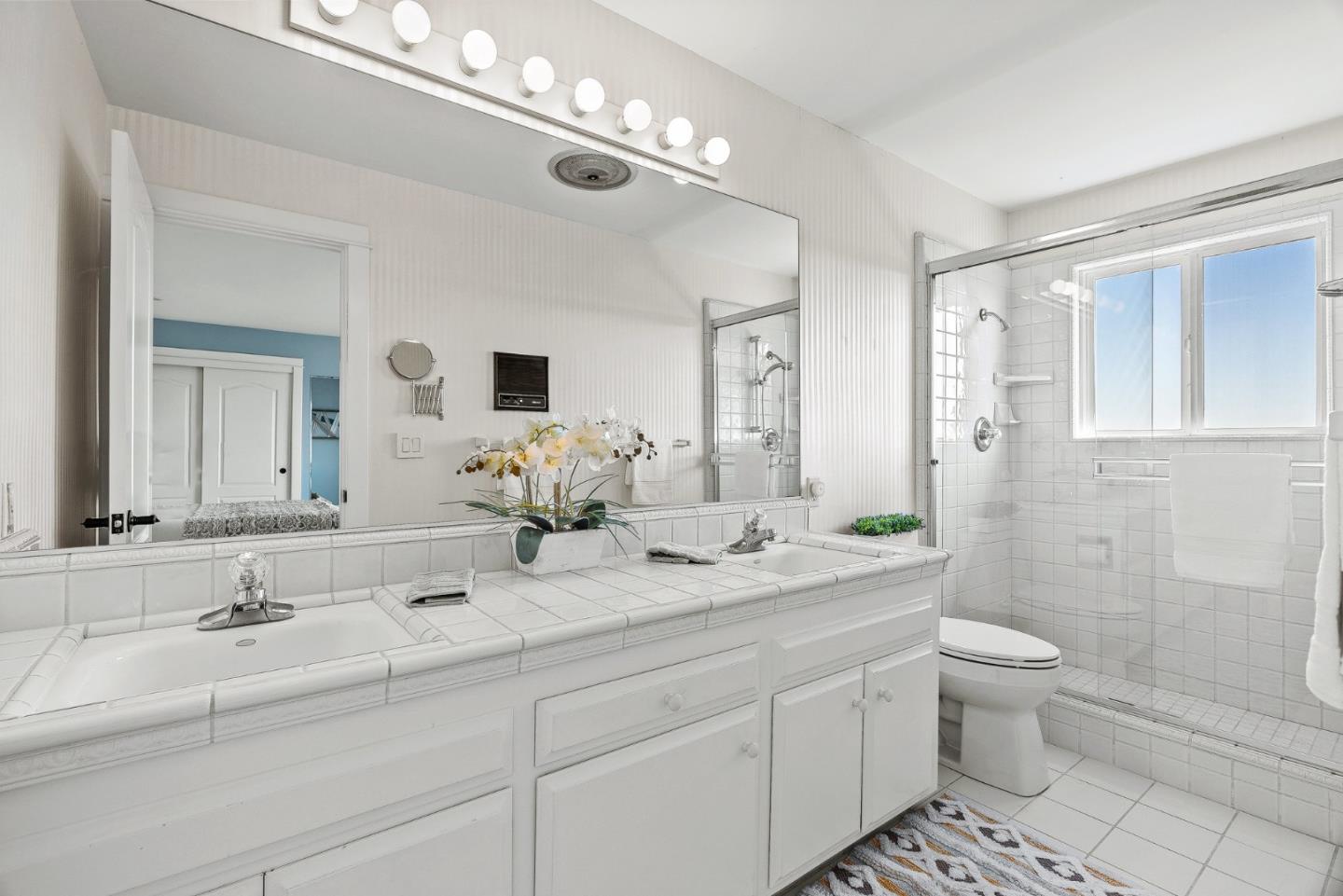 1375 Weston Ridge Road Scotts Valley, CA 95066 - Photo 43 of 68 a bathroom with a double vanity sink mirror and toilet