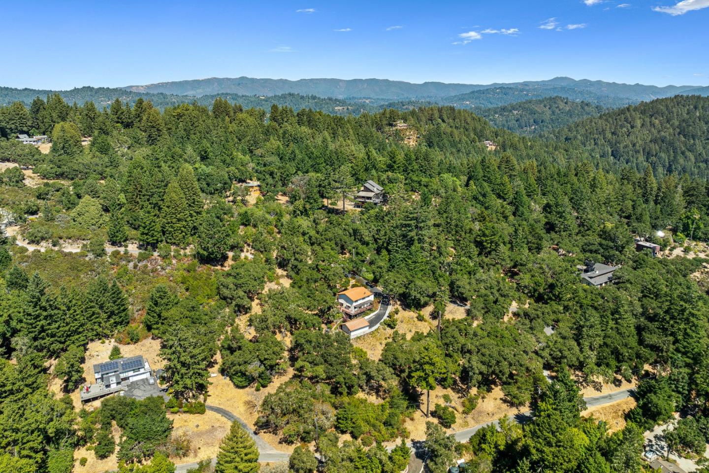 1375 Weston Ridge Road Scotts Valley, CA 95066 - Photo 56 of 68 a view of a lush green forest with a houses