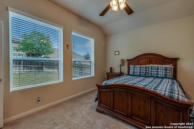 12515 Ponder Ranch San Antonio, TX 78245 - Photo 18 of 27 a bedroom with a bed and window