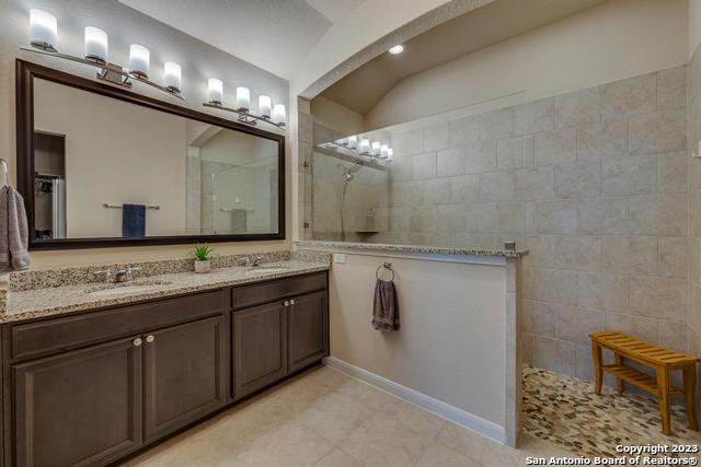 12515 Ponder Ranch San Antonio, TX 78245 - Photo 19 of 27 a bathroom with a sink double vanity and a mirror