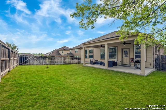 12515 Ponder Ranch San Antonio, TX 78245 - Photo 26 of 27 a view of a house with backyard porch and sitting area