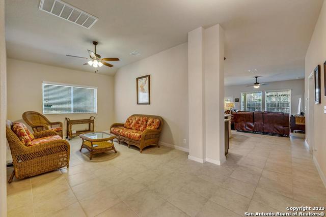 12515 Ponder Ranch San Antonio, TX 78245 - Photo 4 of 27 a living room with furniture and a window