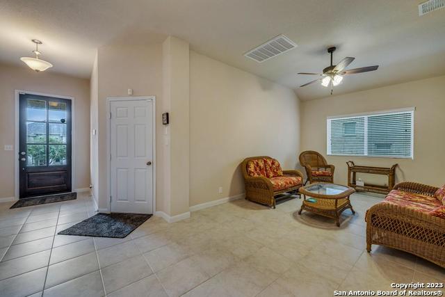 12515 Ponder Ranch San Antonio, TX 78245 - Photo 6 of 27 a bedroom with furniture and a window