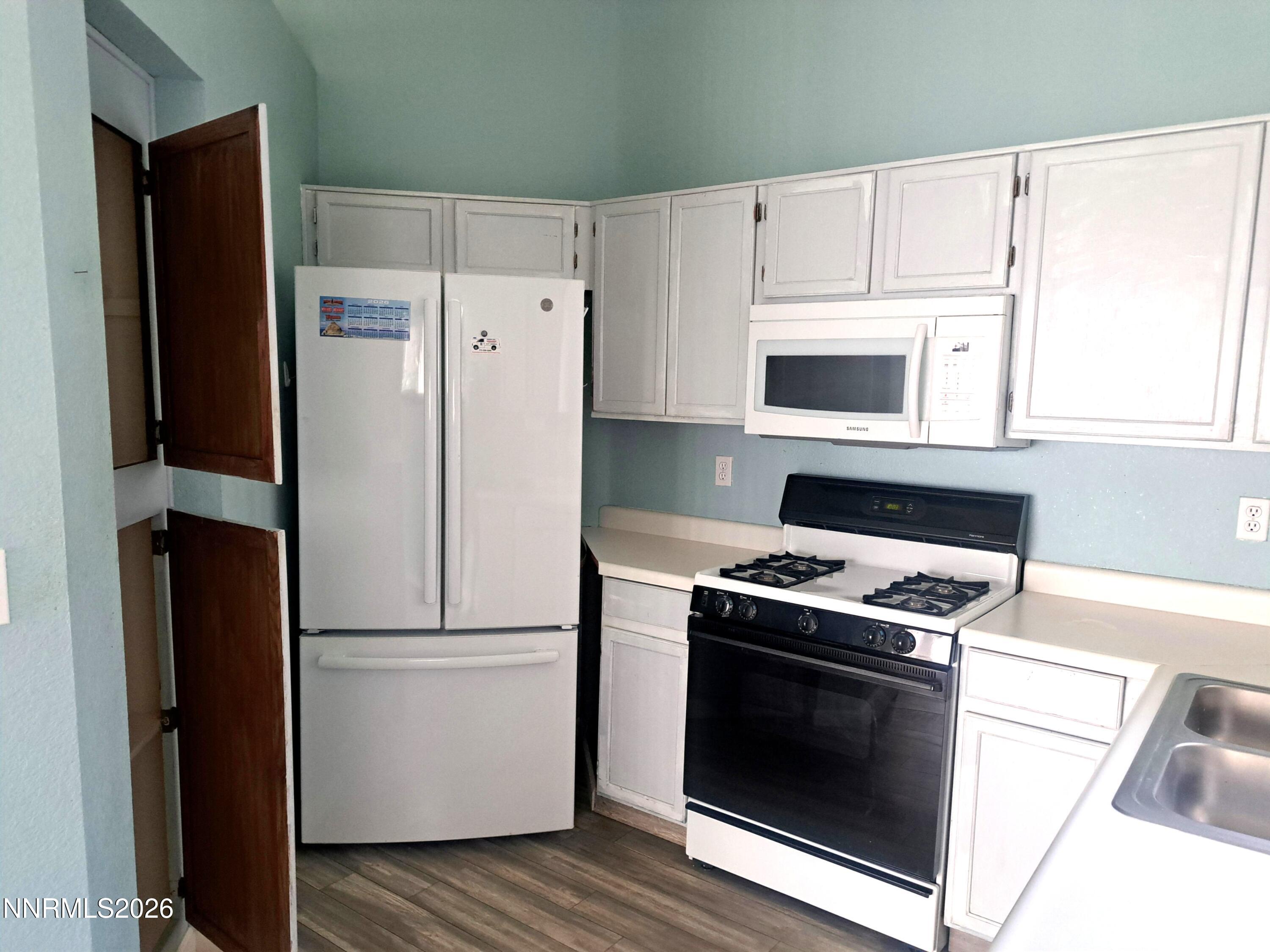 3106 May Rose Circle Reno, NV 89502 - Photo 8 of 22 Kitchen w/pantry cabinet doors open