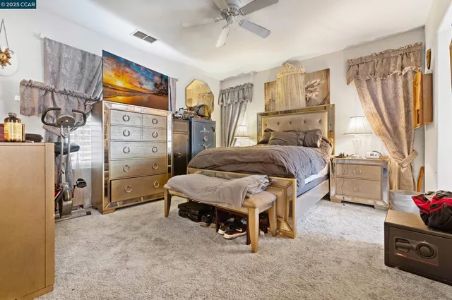 a bedroom with a bed dresser and a window