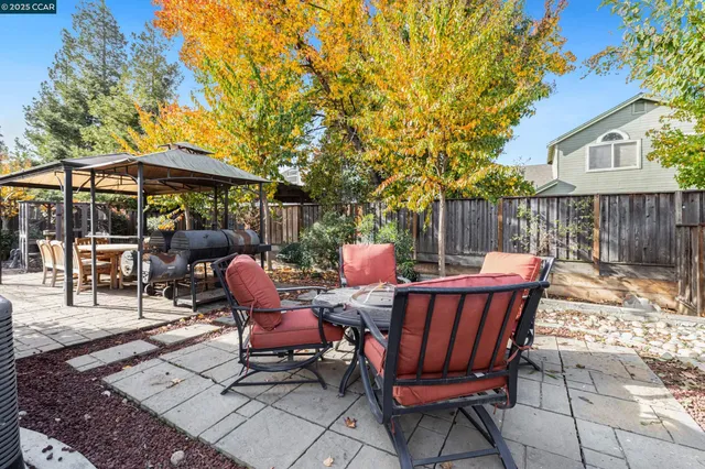 a view of a chairs and tables in the patio