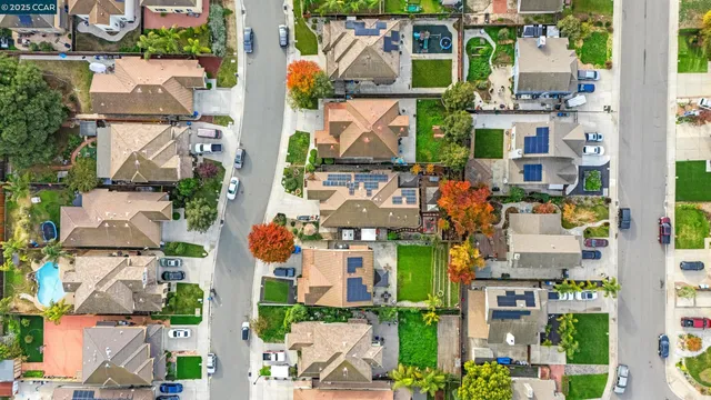 an aerial view of houses with outdoor space