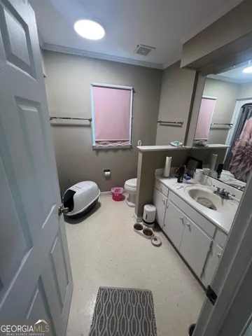 a bedroom with a bed and a mirror