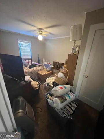 a view of closet with wooden floor
