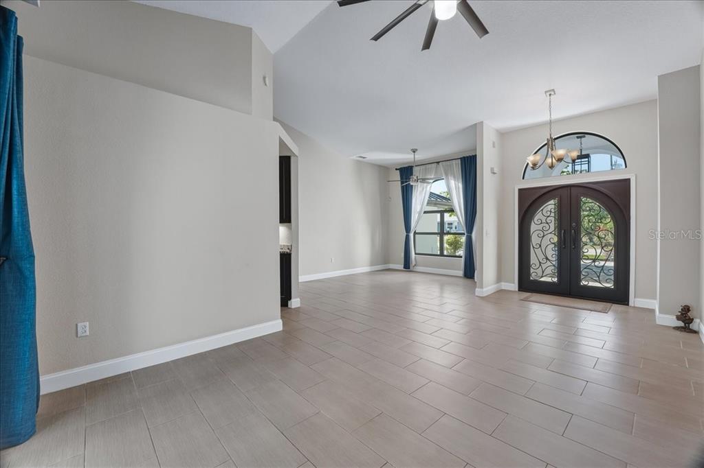 7314 Powder Puff Punta Gorda, FL 33955 - Photo 17 of 48 a view of an empty room and window with wooden floor