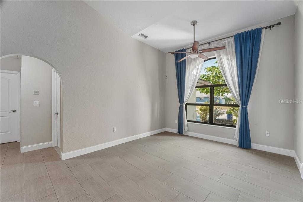 7314 Powder Puff Punta Gorda, FL 33955 - Photo 18 of 48 an empty room with windows and outdoor view