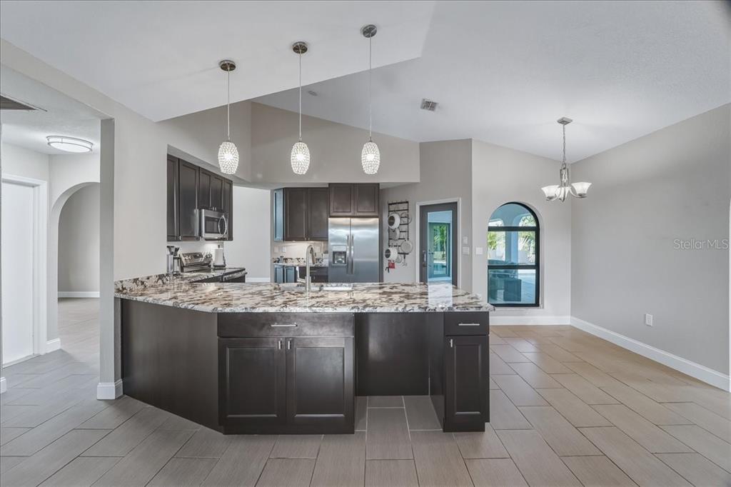 7314 Powder Puff Punta Gorda, FL 33955 - Photo 23 of 48 a kitchen with a sink and cabinets
