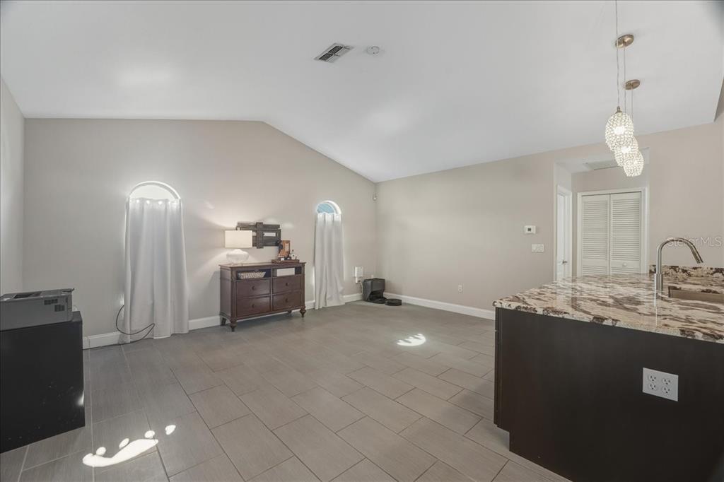 7314 Powder Puff Punta Gorda, FL 33955 - Photo 24 of 48 a living room with furniture and a chandelier