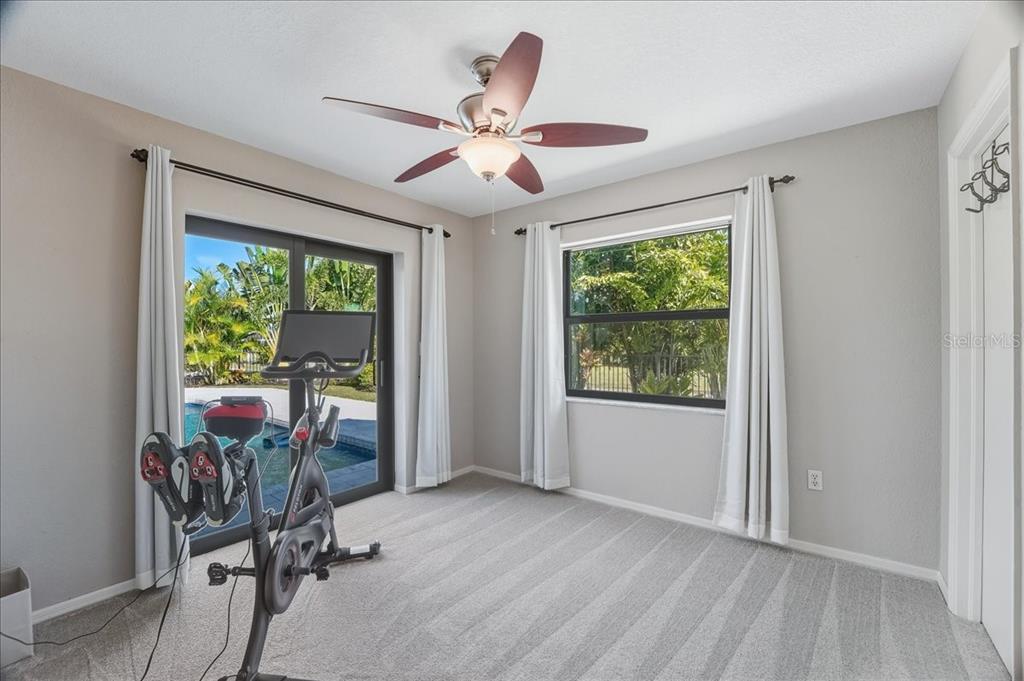 7314 Powder Puff Punta Gorda, FL 33955 - Photo 29 of 48 a view of a livingroom with furniture ceiling fan and window