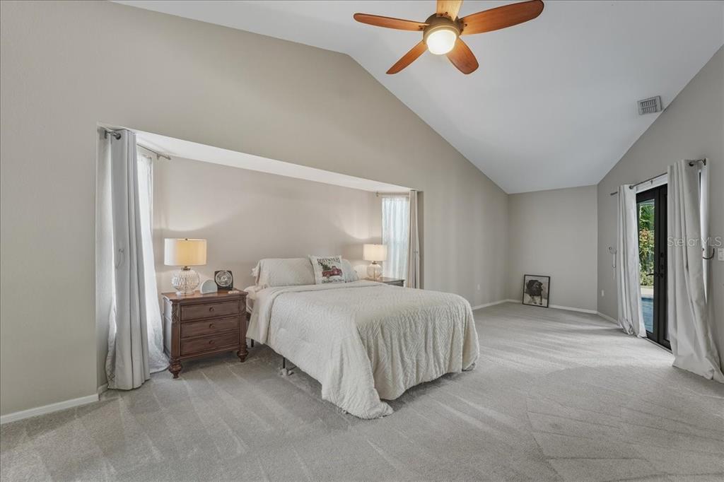 7314 Powder Puff Punta Gorda, FL 33955 - Photo 35 of 48 a bedroom with a bed and a chandelier