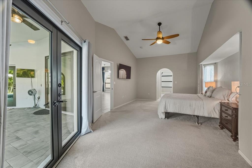 7314 Powder Puff Punta Gorda, FL 33955 - Photo 36 of 48 a bedroom with a bed and a chandelier