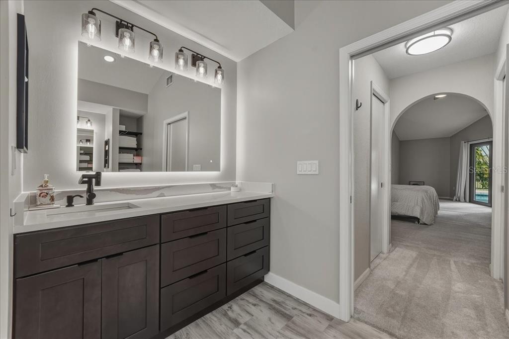 7314 Powder Puff Punta Gorda, FL 33955 - Photo 41 of 48 a en suite bathroom with a sink and a mirror