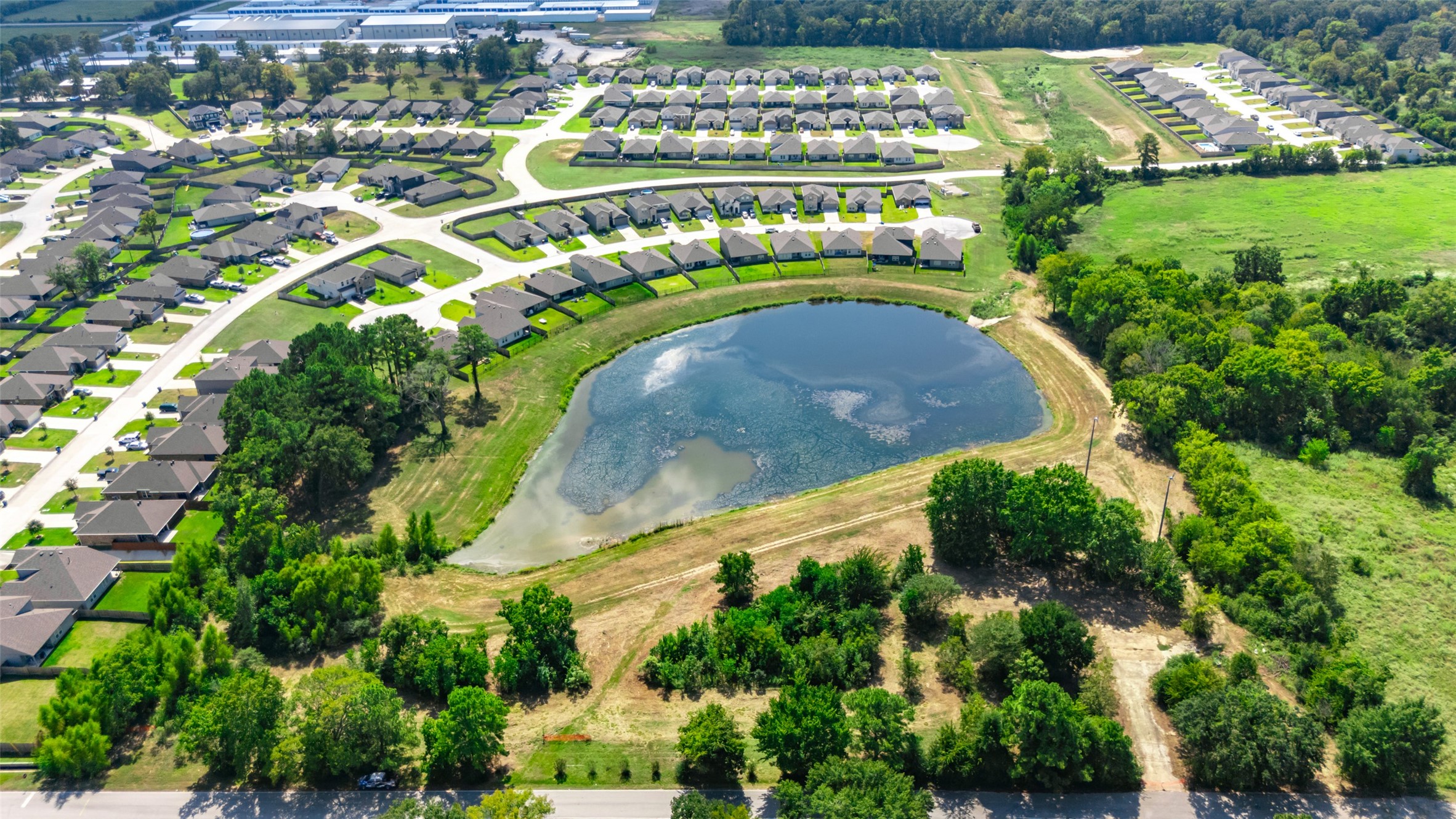 13015 Moon Road Willis, TX 77318 - Photo 2 of 12 an aerial view of a swimming pool and outdoor space
