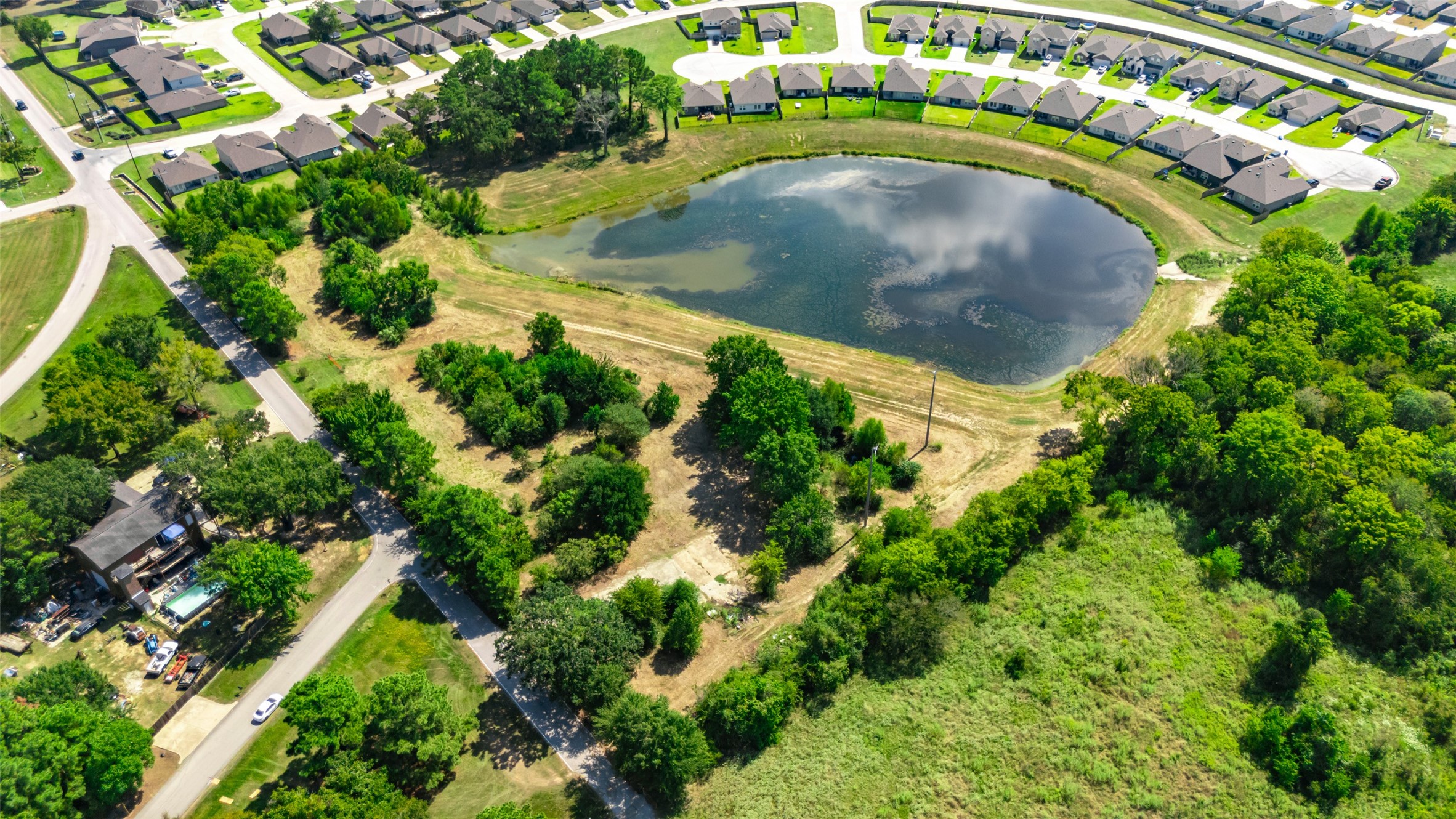 13015 Moon Road Willis, TX 77318 - Photo 3 of 12 an aerial view of a washer and dryer with green space