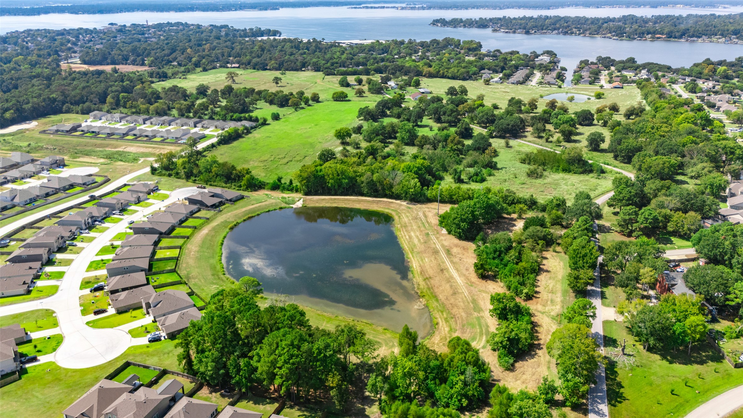 13015 Moon Road Willis, TX 77318 - Photo 8 of 12 an aerial view of a swimming pool with a yard