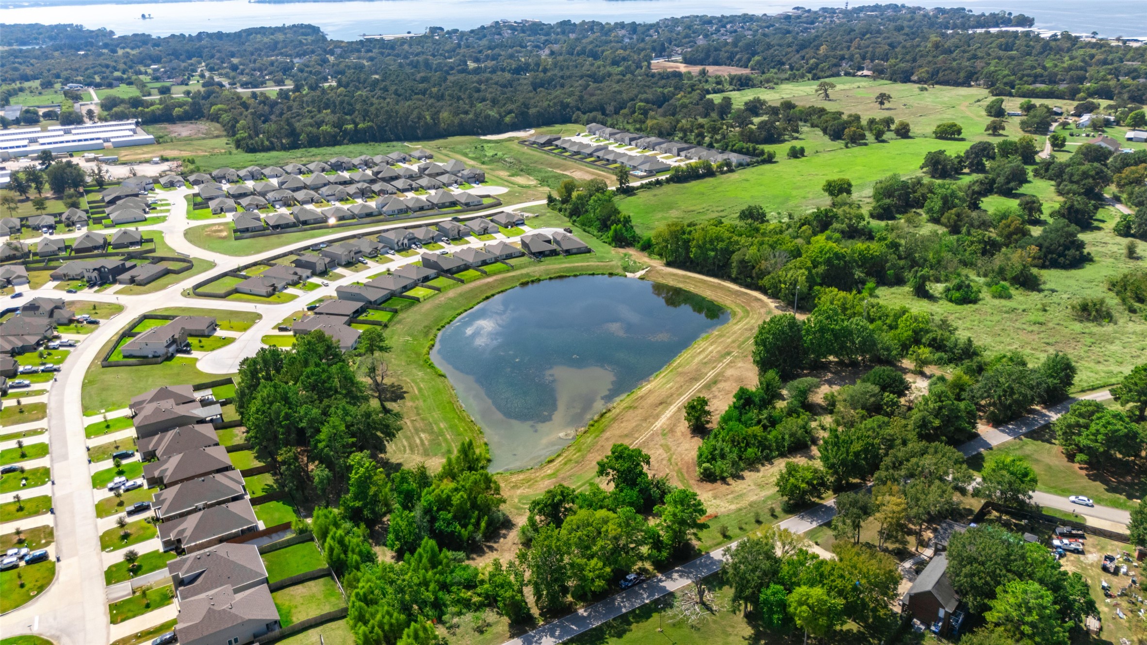 13015 Moon Road Willis, TX 77318 - Photo 9 of 12 an aerial view of residential houses with outdoor space and trees