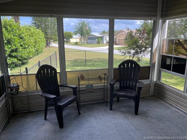 2671 Southwest Versailles Terrace Stuart, FL 34997 - Photo 2 of 9 a view of a chairs in balcony