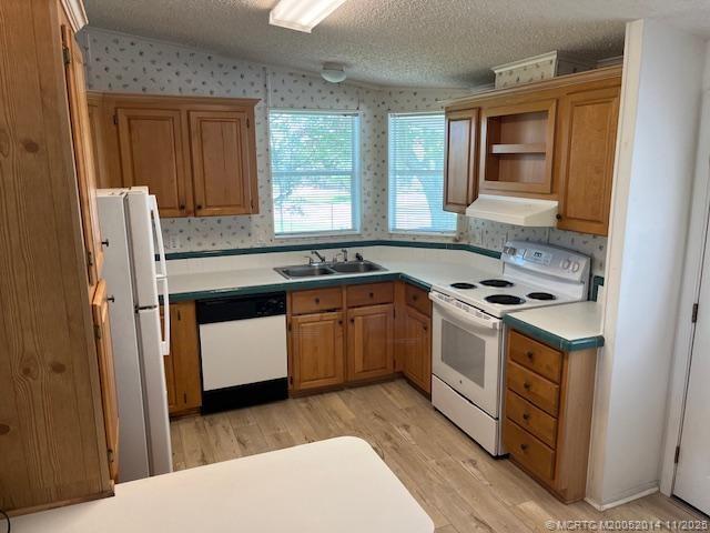 2671 Southwest Versailles Terrace Stuart, FL 34997 - Photo 3 of 9 a kitchen with a stove and a sink