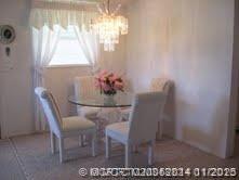 2671 Southwest Versailles Terrace Stuart, FL 34997 - Photo 4 of 9 a dining room with furniture and window