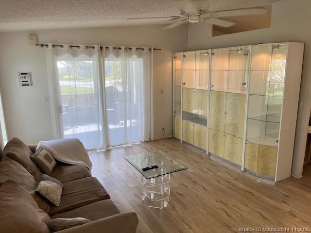 2671 Southwest Versailles Terrace Stuart, FL 34997 - Photo 5 of 9 a living room with furniture and a large window