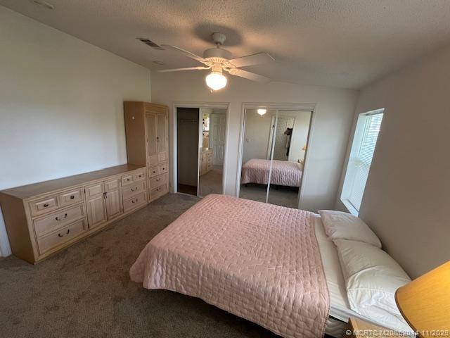 2671 Southwest Versailles Terrace Stuart, FL 34997 - Photo 7 of 9 a bedroom with a large bed and a chandelier