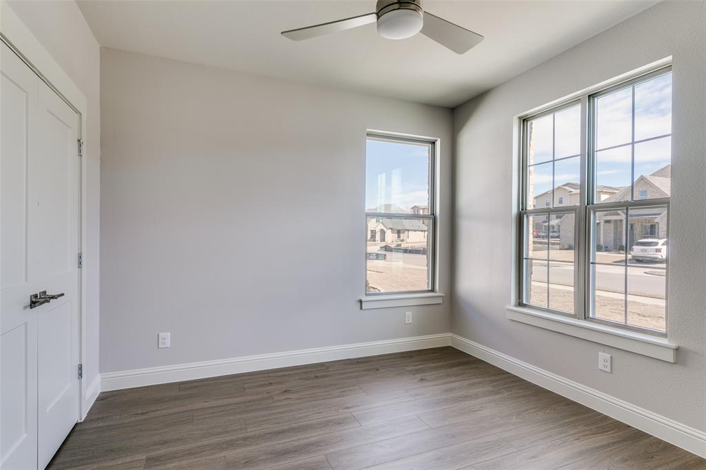 622 Community Lane Rockwall, TX 75087 - Photo 18 of 27 wooden floor in an empty room with a window