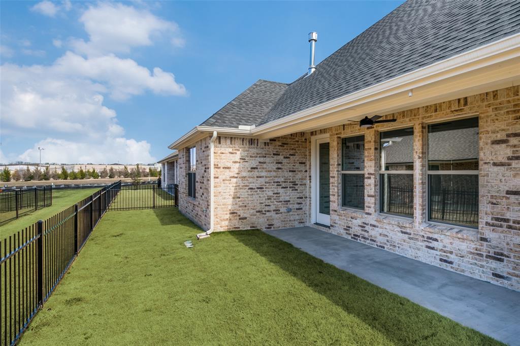 622 Community Lane Rockwall, TX 75087 - Photo 25 of 27 a view of a house with a yard