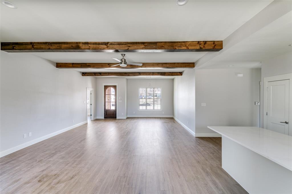 622 Community Lane Rockwall, TX 75087 - Photo 4 of 27 wooden floor in an empty room