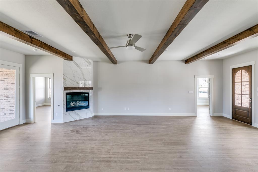 622 Community Lane Rockwall, TX 75087 - Photo 6 of 27 a view of an empty room with window and fireplace