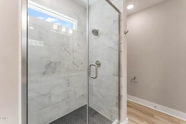 a bathroom with a shower and toilet
