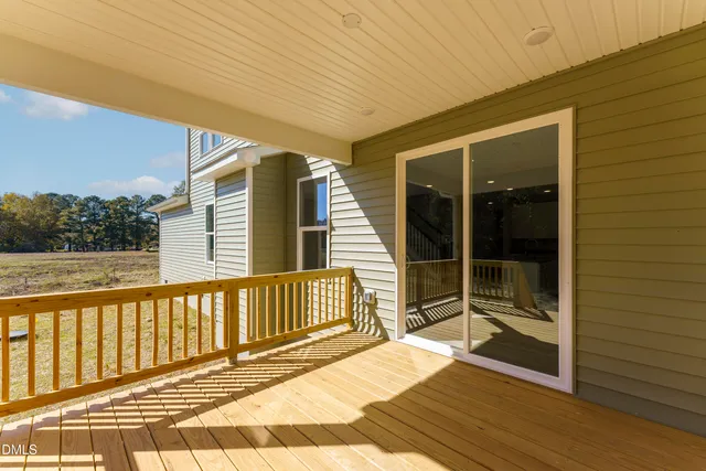 a view of house with outdoor space and sitting area