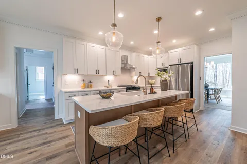 a spacious bathroom with a double vanity sink mirror double shower and a bathtub