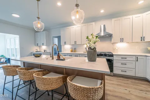 a white bath tub sitting next to a shower
