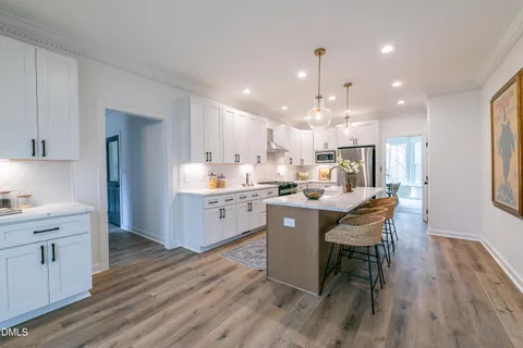 an empty room with a window and a ceiling fan