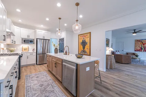 a spacious bathroom with a double vanity sink and a mirror