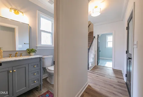 a front view of a house with a yard table and chairs